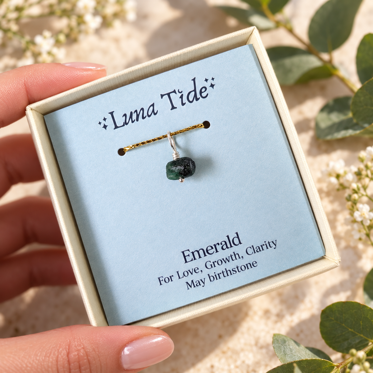 Raw Emerald crystal birthstone charm in sterling silver in a Luna Tide gift box